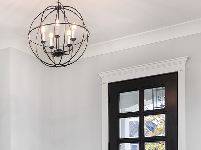 Fancy light fixture above entryway.